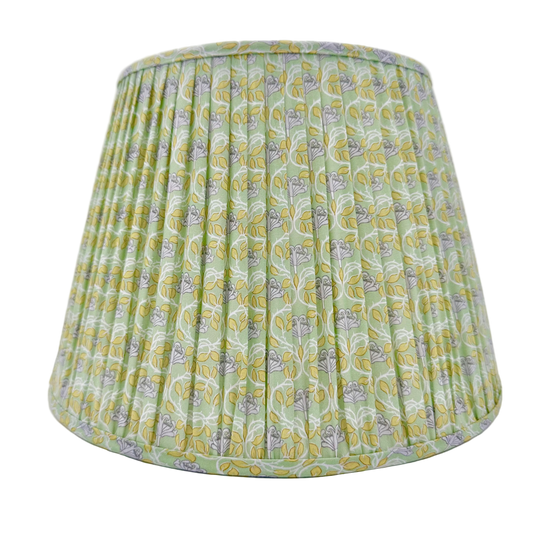 Green patterned lampshade on a white background